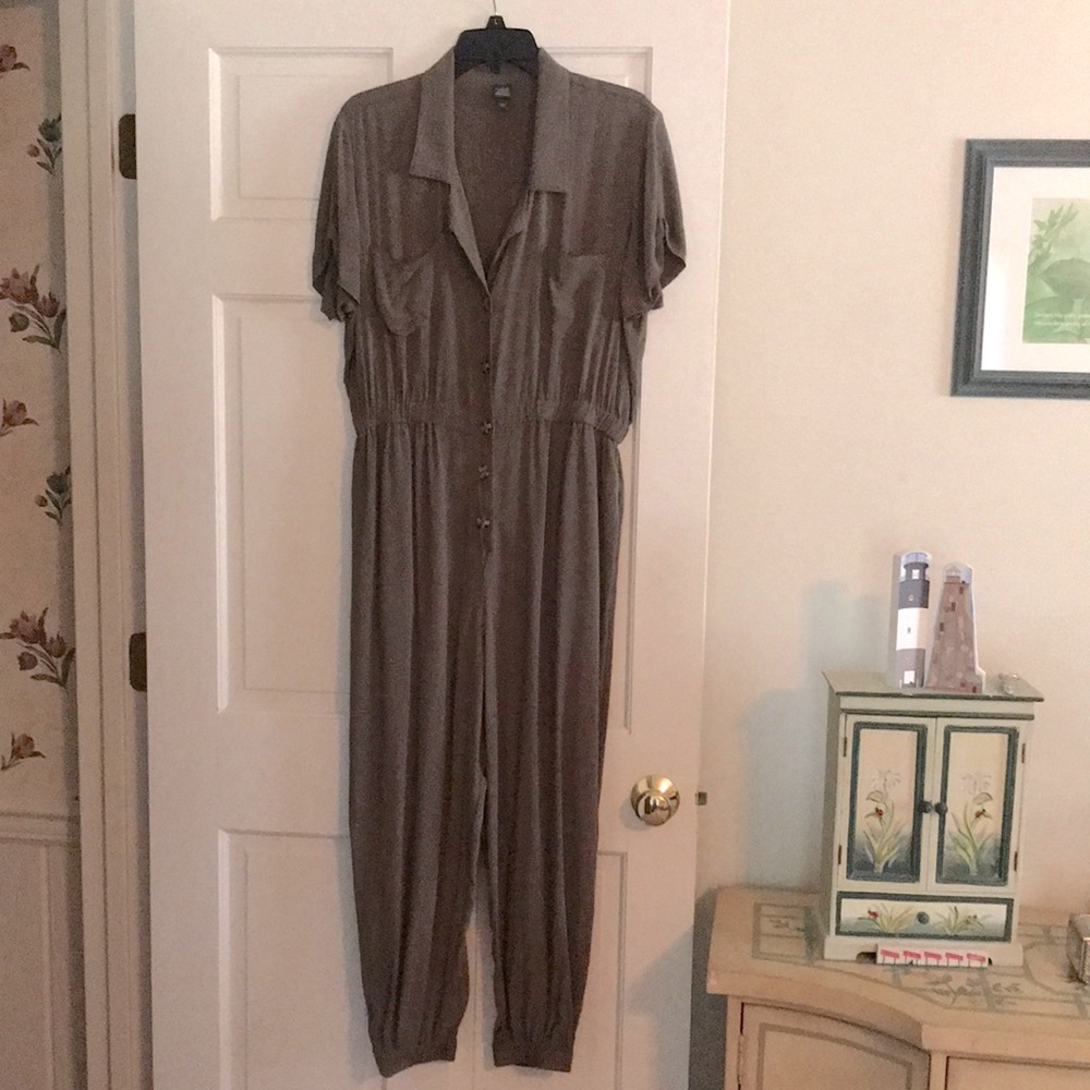 Olive green jumper with jogger cuff at ankles.